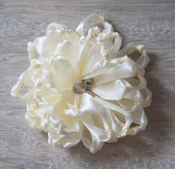 A Fabric Flower with crystal bead embellishments made using the Knotted Chrysanthemum How To Tutorial